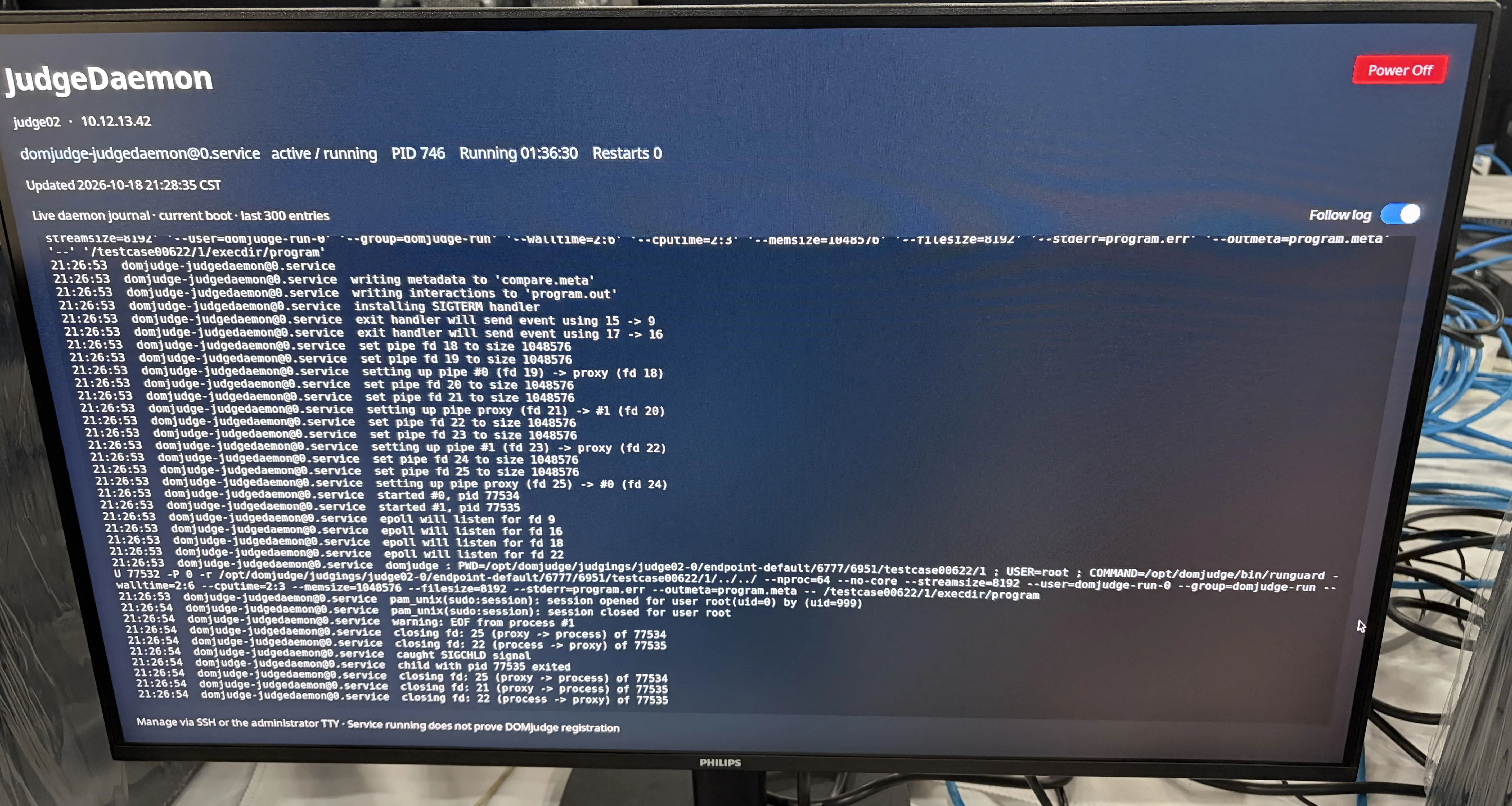 评测版镜像的 JudgeDaemon 状态与实时日志界面